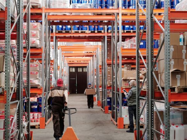 men working in factory warehouse