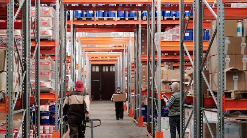 men working in factory warehouse