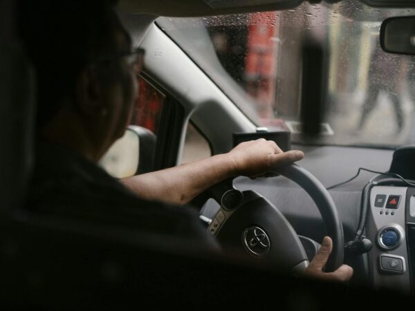 driver siting in car in rainy weather
