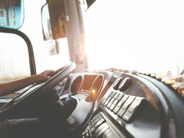 person hand on steering wheel