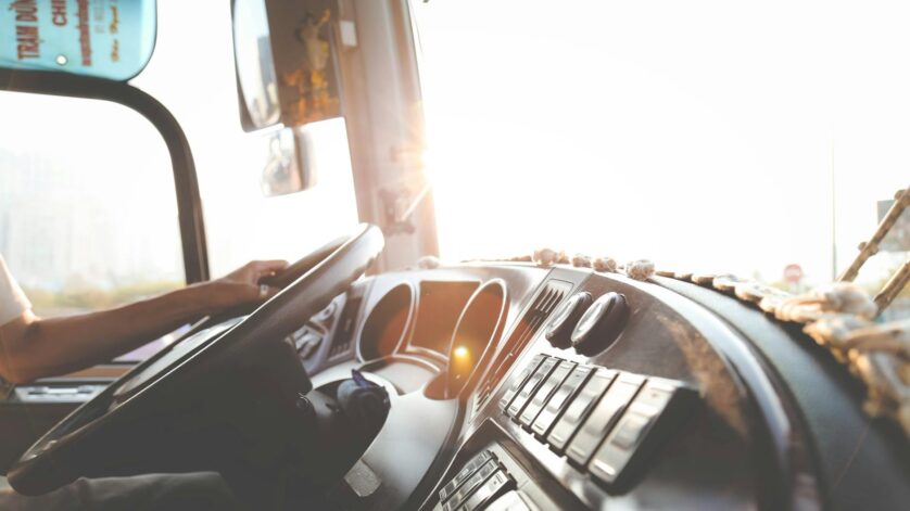 person hand on steering wheel